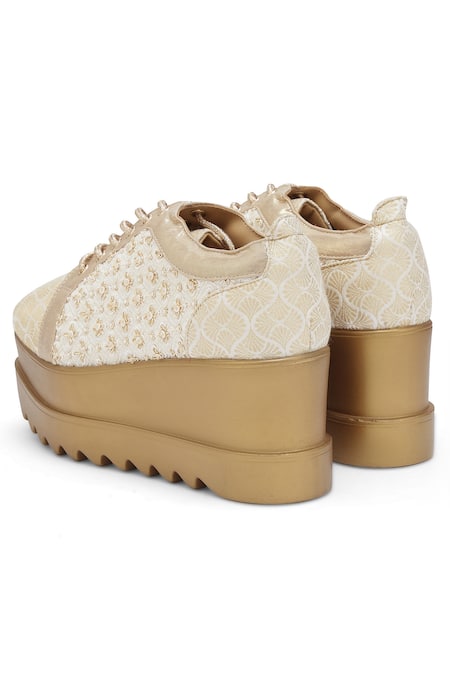 Anaar_Off White Rumi Embroidered Wedge Sneakers _at_Aza_Fashions