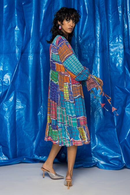 Shop Doh Tak Keh Blue Cotton Tassels V-neck Gingham Printed Tiered Wrap Dress at Aza Fashions Shop_Doh Tak Keh_Blue Cotton Tassels V-neck Gingham Printed Tiered Wrap Dress_at_Aza_Fashions