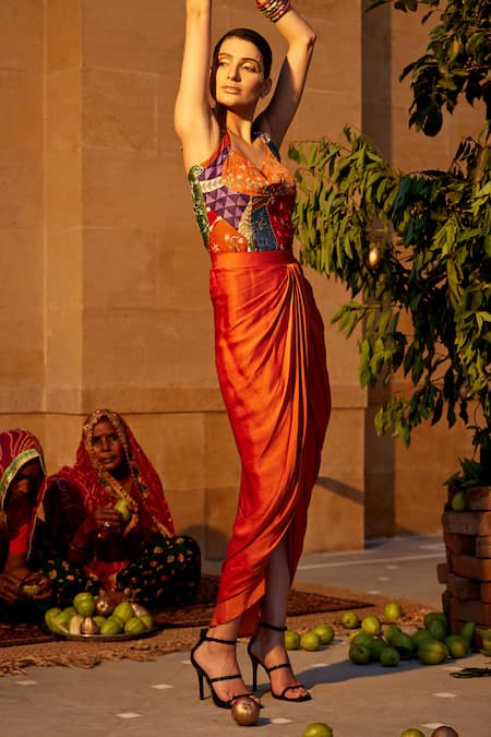 Shop Amrood Orange Modal, Satin Beads, Embroidery Halter Neck Printed Top And Draped Skirt Set at Aza Fashions Shop_Amrood_Orange Modal, Satin Beads, Embroidery Halter Neck Printed Top And Draped Skirt Set _at_Aza_Fashions