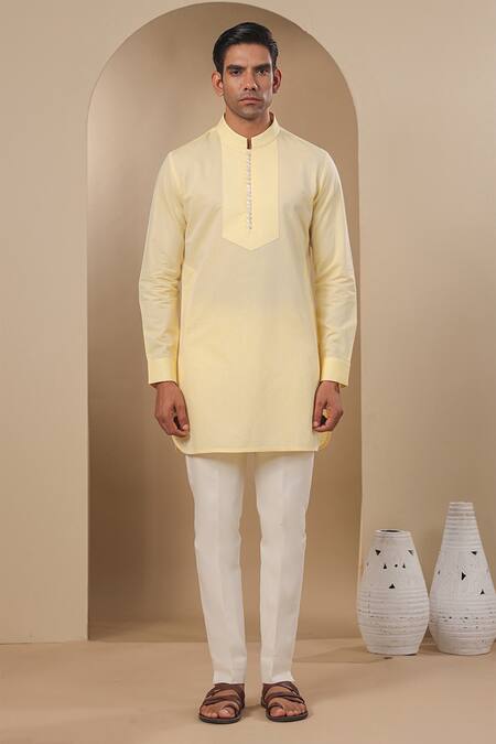 Buy Raw & Rustic By Niti Bothra Yellow Chanderi, Silk Embroidery Pleated Placket Solid Kurta Online at Aza Fashions Buy_Raw & Rustic By Niti Bothra_Yellow Chanderi, Silk Embroidery Pleated Placket Solid Kurta _Online_at_Aza_Fashions