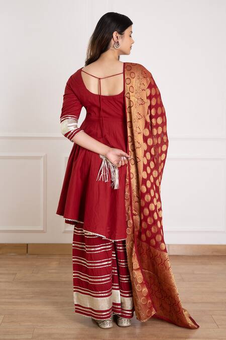 Shop Pheeta Maroon Cotton Woven Gota Patti Work Sharara Set With Banarasi Dupatta at Aza Fashions Shop_Pheeta_Maroon Cotton Woven Gota Patti Work Sharara Set With Banarasi Dupatta _at_Aza_Fashions