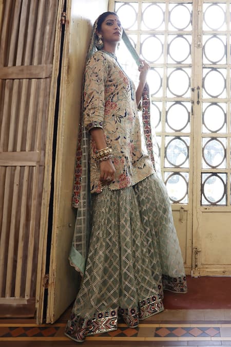Shop Vikram Phadnis Beige Silk, Net Embroidery, Tassels Round Neck Bloom Garden Kurta Sharara Set at Aza Fashions Shop_Vikram Phadnis_Beige Silk, Net Embroidery, Tassels Round Neck Bloom Garden Kurta Sharara Set _at_Aza_Fashions