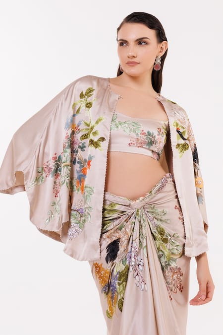 Shop Eeksha Beige Satin, Ramie Sequins, Beads Botanical Print Caplet And Draped Skirt Set at Aza Fashions Shop_Eeksha_Beige Satin, Ramie Sequins, Beads Botanical Print Caplet And Draped Skirt Set _at_Aza_Fashions