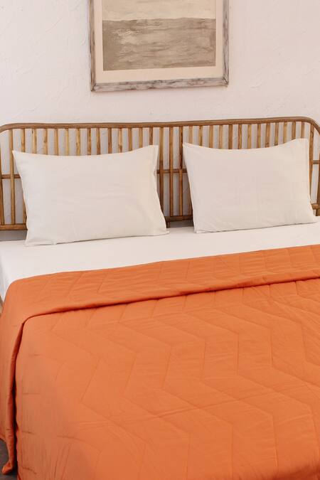 House This_Orange Cotton Satin Karanji Chevron Quilted Bedcover_Online_at_Aza_Fashions