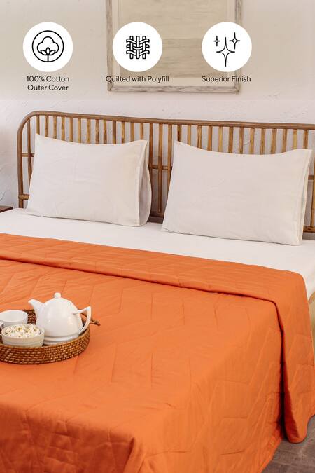 House This_Orange Cotton Satin Karanji Chevron Quilted Bedcover_at_Aza_Fashions