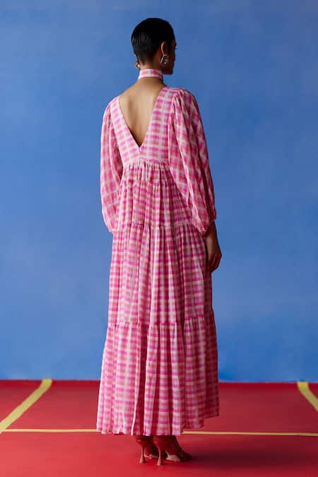 Shop Uri By Mrunalini Rao Pink Cotton V-neck Cassia Gingham Checkered Tiered Maxi Dress at Aza Fashions Shop_Uri By Mrunalini Rao_Pink Cotton V-neck Cassia Gingham Checkered Tiered Maxi Dress _at_Aza_Fashions