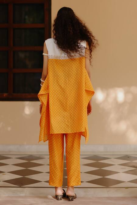 Shop Avacara Yellow Chanderi Print Hand Block Round Asymmetric Kurta With Pant at Aza Fashions Shop_Avacara_Yellow Chanderi Print Hand Block Round Asymmetric Kurta With Pant _at_Aza_Fashions