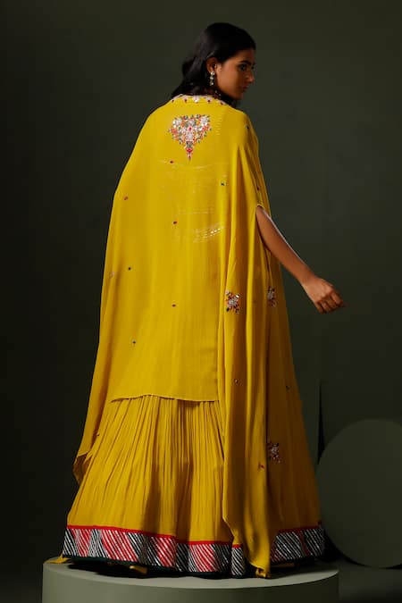 Shop Two Sisters By Gyans Yellow Georgette Crystals, Mirrors, Nimbu Mirchi Embellished Cape Lehenga Set at Aza Fashions Shop_Two Sisters By Gyans_Yellow Georgette Crystals, Mirrors, Nimbu Mirchi Embellished Cape Lehenga Set _at_Aza_Fashions