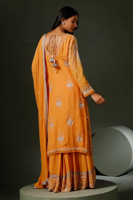 Shop Two Sisters By Gyans Orange Georgette Sequins, Stones Zari Mirror Embroidered Kurta Sharara Set at Aza Fashions Shop_Two Sisters By Gyans_Orange Georgette Sequins, Stones Zari Mirror Embroidered Kurta Sharara Set _at_Aza_Fashions