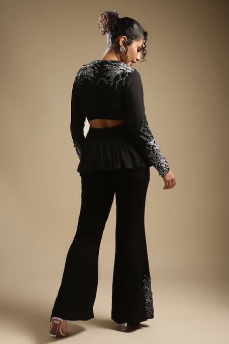 Shop Sakshi Khetterpal Black Georgette Embroidery Sequin V Neck Peplum Top And Bell Bottom Pant Set at Aza Fashions Shop_Sakshi Khetterpal_Black Georgette Embroidery Sequin V Neck Peplum Top And Bell Bottom Pant Set _at_Aza_Fashions