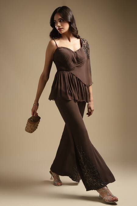 Sakshi Khetterpal Brown Georgette Embroidery One Shoulder Peplum Top And Bell Bottom Pant Set at Aza Fashions Sakshi Khetterpal_Brown Georgette Embroidery One Shoulder Peplum Top And Bell Bottom Pant Set _at_Aza_Fashions