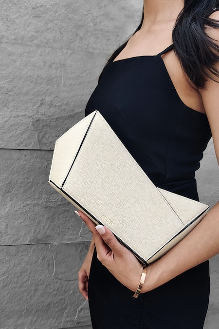 Shop_Adisee_Ivory Plain Leather Abstract Structured Clutch _Online_at_Aza_Fashions