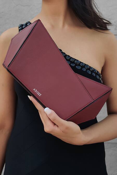 Adisee_Maroon Plain Abstract Structured Leather Clutch _at_Aza_Fashions