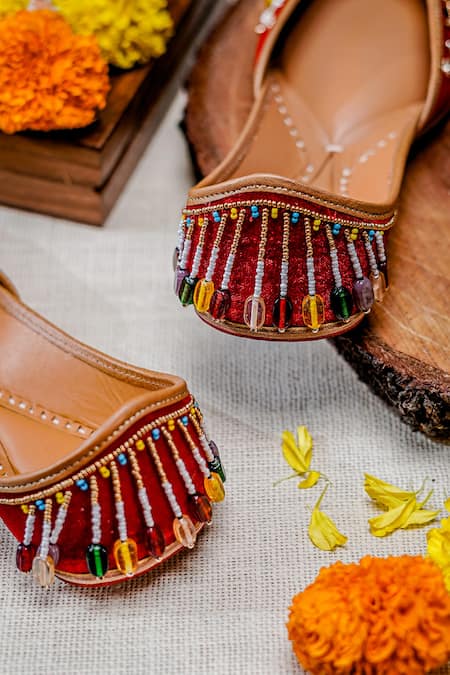 Shop NR By Nidhi Rathi Red Embellished Navratna Stone Juttis Shop_NR By Nidhi Rathi_Red Embellished Navratna Stone Juttis