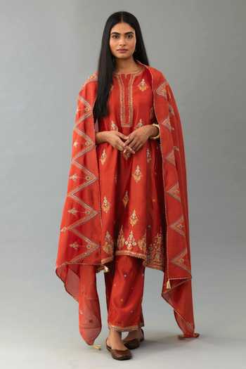 Off white cotton chanderi A-line kurta set features with all-over purple and green lotus flower hand block print.