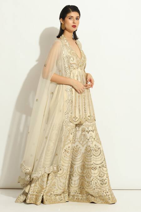 Buy_Vandana Sethi_Ivory Silk Embroidery, Mirrors Halter Neck Embellished Kurta Gharara Set _Online_at_Aza_Fashions