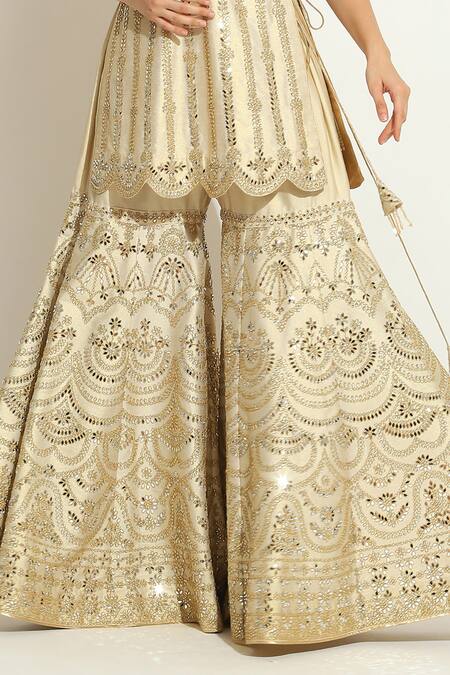 Vandana Sethi_Ivory Silk Embroidery, Mirrors Halter Neck Embellished Kurta Gharara Set _at_Aza_Fashions