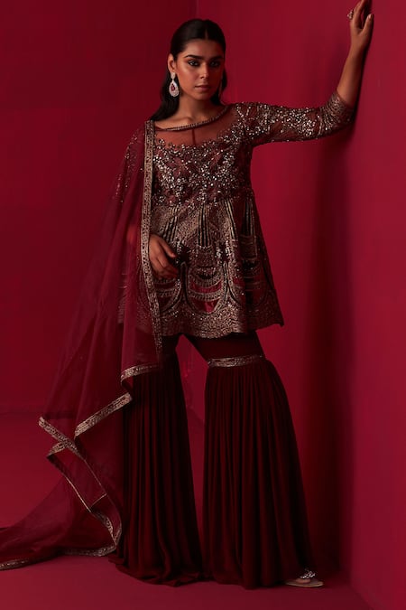 Shop Adaara Couture Maroon Silk, Georgette, Organza Sequins, Beads, Glitch Peplum Top Sharara Set at Aza Fashions Shop_Adaara Couture_Maroon Silk, Georgette, Organza Sequins, Beads, Glitch Peplum Top Sharara Set _at_Aza_Fashions