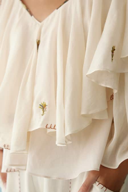 Shop_Nikasha_Cream Cotton Applique, Embroidery V-neck Thread Frilled Top _Online_at_Aza_Fashions