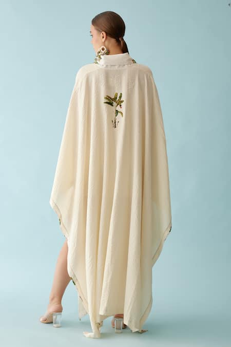 Shop Nikasha Cream Fronds Print Lapel Collar Seersucker Cape at Aza Fashions Shop_Nikasha_Cream Fronds Print Lapel Collar Seersucker Cape _at_Aza_Fashions