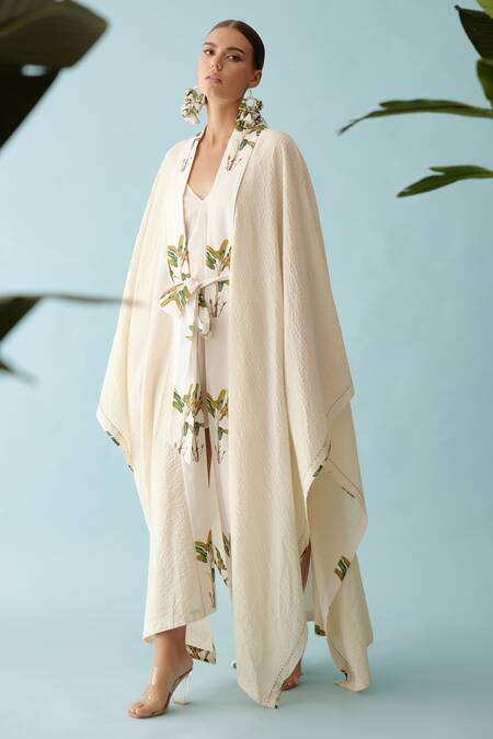 Nikasha Cream Fronds Print Lapel Collar Seersucker Cape Online at Aza Fashions Nikasha_Cream Fronds Print Lapel Collar Seersucker Cape _Online_at_Aza_Fashions