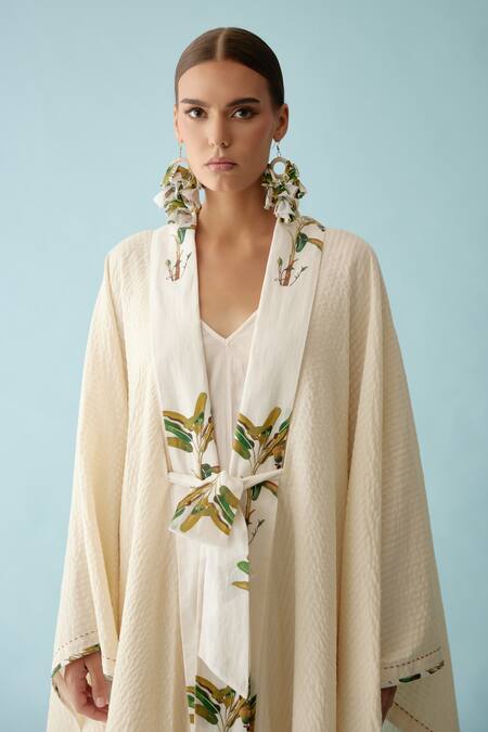 Buy Nikasha Cream Fronds Print Lapel Collar Seersucker Cape Online at Aza Fashions Buy_Nikasha_Cream Fronds Print Lapel Collar Seersucker Cape _Online_at_Aza_Fashions