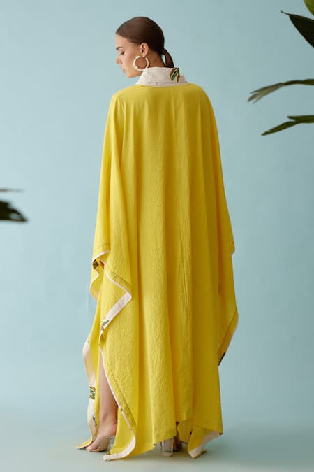 Shop Nikasha Yellow Banana Leaf Print Lapel Collar Seersucker Cape at Aza Fashions Shop_Nikasha_Yellow Banana Leaf Print Lapel Collar Seersucker Cape _at_Aza_Fashions