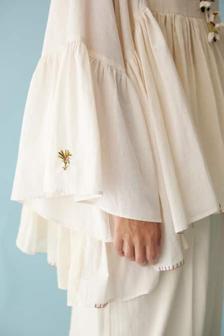 Shop_Nikasha_Cream Handloom Cotton Embroidery Round Neck Tasseled Asymmetric Blouse _Online_at_Aza_Fashions