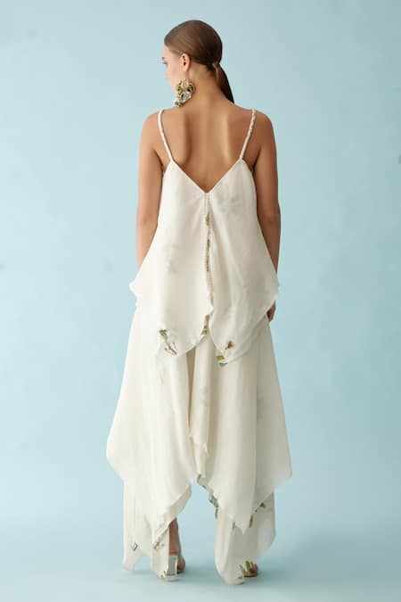 Shop Nikasha Off White Cotton Embroidery V-neck Asymmetrical Layered Top And Skirt Set at Aza Fashions Shop_Nikasha_Off White Cotton Embroidery V-neck Asymmetrical Layered Top And Skirt Set _at_Aza_Fashions