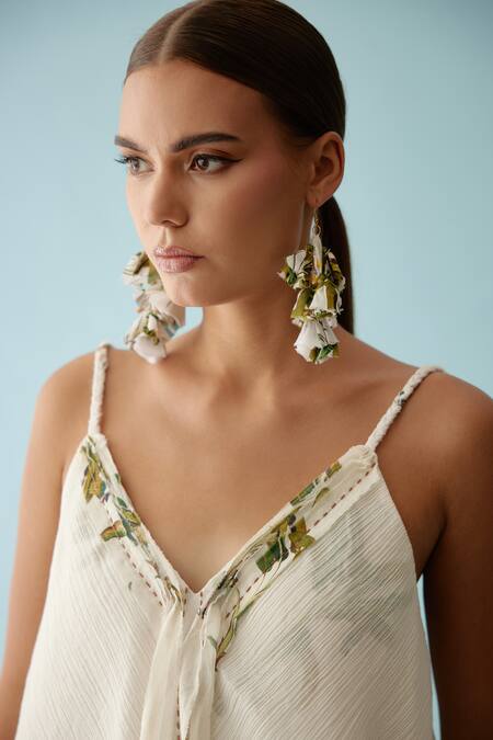 Nikasha Off White Cotton Embroidery V-neck Asymmetrical Layered Top And Skirt Set at Aza Fashions Nikasha_Off White Cotton Embroidery V-neck Asymmetrical Layered Top And Skirt Set _at_Aza_Fashions