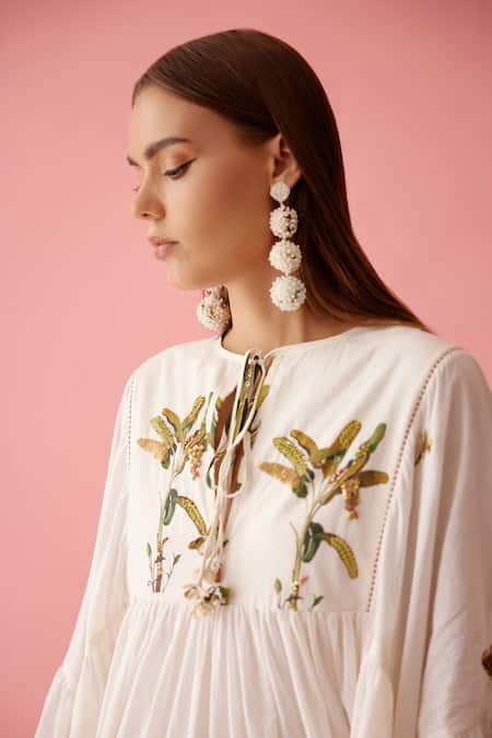 Buy_Nikasha_Cream Cotton Tassels V-neck Banana Tree Print Yoke Frill Dress _Online_at_Aza_Fashions