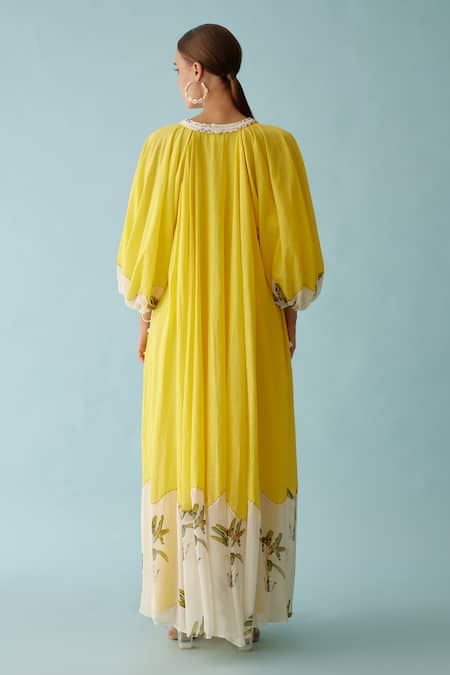 Shop Nikasha Yellow Cotton V-neck Frond Print Braided Tassel Maxi Dress at Aza Fashions Shop_Nikasha_Yellow Cotton V-neck Frond Print Braided Tassel Maxi Dress _at_Aza_Fashions
