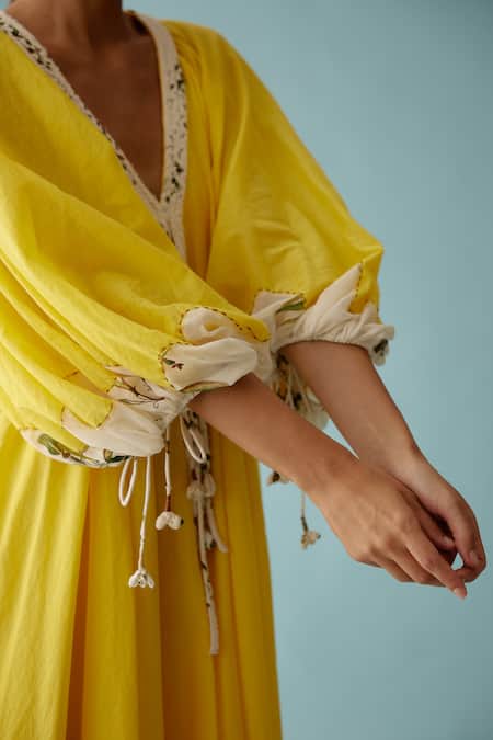 Buy Nikasha Yellow Cotton V-neck Frond Print Braided Tassel Maxi Dress Online at Aza Fashions Buy_Nikasha_Yellow Cotton V-neck Frond Print Braided Tassel Maxi Dress _Online_at_Aza_Fashions