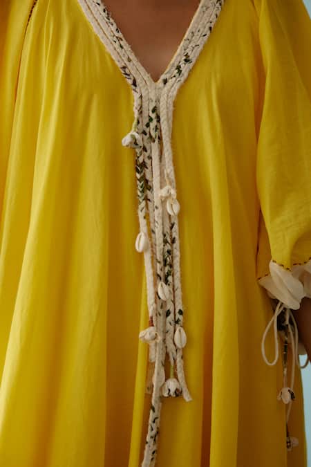 Shop Nikasha Yellow Cotton V-neck Frond Print Braided Tassel Maxi Dress Online at Aza Fashions Shop_Nikasha_Yellow Cotton V-neck Frond Print Braided Tassel Maxi Dress _Online_at_Aza_Fashions