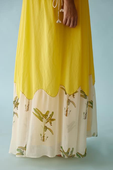 Nikasha Yellow Cotton V-neck Frond Print Braided Tassel Maxi Dress at Aza Fashions Nikasha_Yellow Cotton V-neck Frond Print Braided Tassel Maxi Dress _at_Aza_Fashions