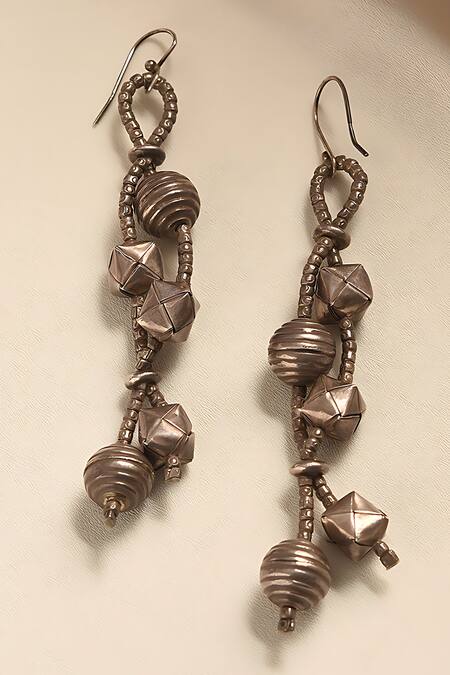 Shop_Mero Jewellery_Silver Plated Tribal Carved Dangler Earrings _at_Aza_Fashions