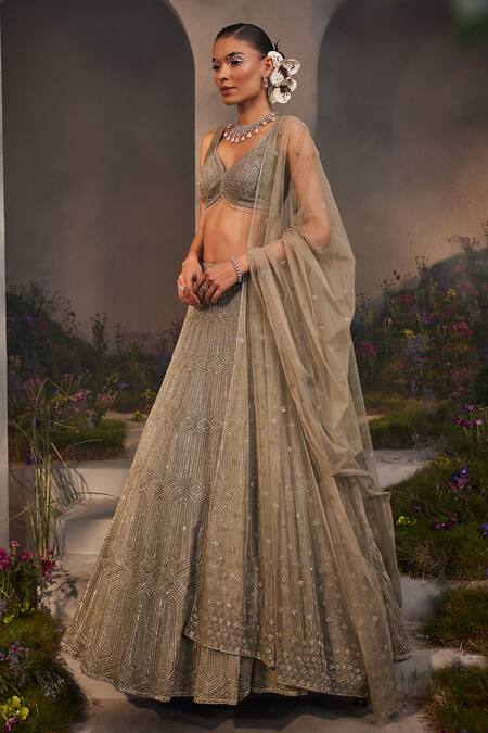 Charu And Vasundhara_Silver Net Beads, Stones, Cut Work Lily Embroidered Bridal Lehenga Set _Online_at_Aza_Fashions