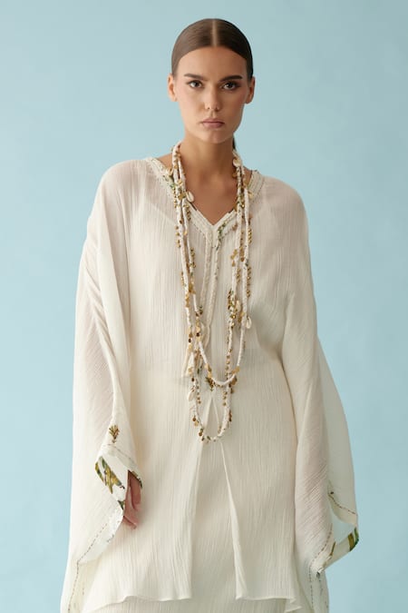 Nikasha Off White V-neck Banana Tree Applique Kaftan And Skirt Set Online at Aza Fashions Nikasha_Off White V-neck Banana Tree Applique Kaftan And Skirt Set _Online_at_Aza_Fashions