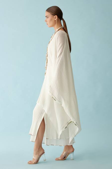 Nikasha Off White V-neck Banana Tree Applique Kaftan And Skirt Set at Aza Fashions Nikasha_Off White V-neck Banana Tree Applique Kaftan And Skirt Set _at_Aza_Fashions