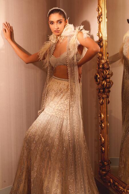 Eeksha Beige Net Pearls, Feathers Resa Embroidered Cape Flared Pant Set at Aza Fashions Eeksha_Beige Net Pearls, Feathers Resa Embroidered Cape Flared Pant Set _at_Aza_Fashions