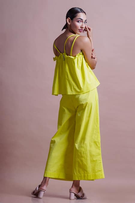 Shop Ekastories Green Cotton Ruffles Split V-neck Draped Top And Wide Leg Pant Set at Aza Fashions Shop_Ekastories_Green Cotton Ruffles Split V-neck Draped Top And Wide Leg Pant Set_at_Aza_Fashions