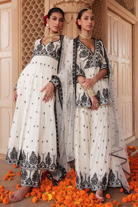 Preevin White Cotton, Net, Tulle Floral Mirrorwork Embellished Peplum Kurta Sharara Set Online at Aza Fashions Preevin_White Cotton, Net, Tulle Floral Mirrorwork Embellished Peplum Kurta Sharara Set _Online_at_Aza_Fashions