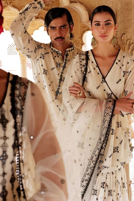 Shop Preevin White Cotton, Net, Tulle Mirrors, Embroidery Floral Jaal Angarakha Sharara Set at Aza Fashions Shop_Preevin_White Cotton, Net, Tulle Mirrors, Embroidery Floral Jaal Angarakha Sharara Set _at_Aza_Fashions