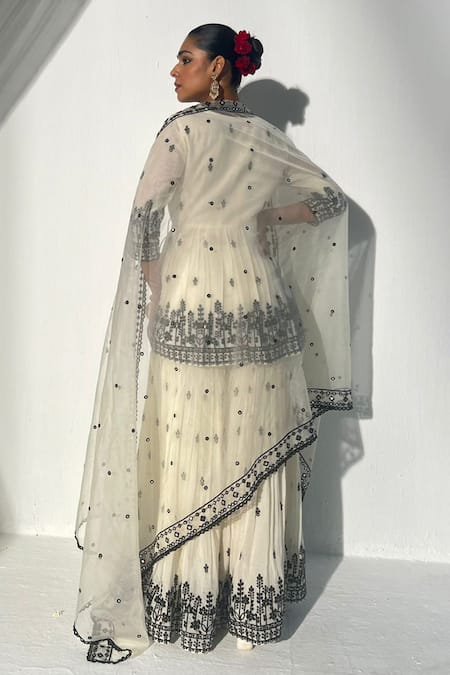 Shop Preevin White Cotton, Net Mirrors, Embroidery V-neck Floral Sprig Angarakha Sharara Set at Aza Fashions Shop_Preevin_White Cotton, Net Mirrors, Embroidery V-neck Floral Sprig Angarakha Sharara Set _at_Aza_Fashions