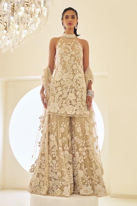Buy_Seema Gujral_Beige Net Lace, Sequins, Embroidery Halter Neck Floral Sheer Kurta Sharara Set _Online_at_Aza_Fashions