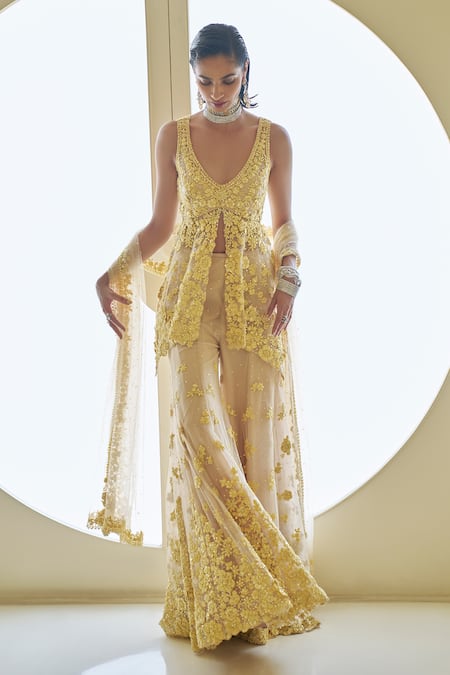 Buy_Seema Gujral_Yellow Net Sequins, Beads, Embroidery V-neck Flower Peplum Tunic Sharara Set _Online_at_Aza_Fashions