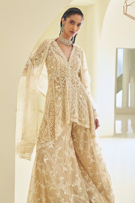 Shop_Seema Gujral_Beige Net Sequins, Pearls, Paisley Embroidered High-low Jacket Sharara Set _Online_at_Aza_Fashions