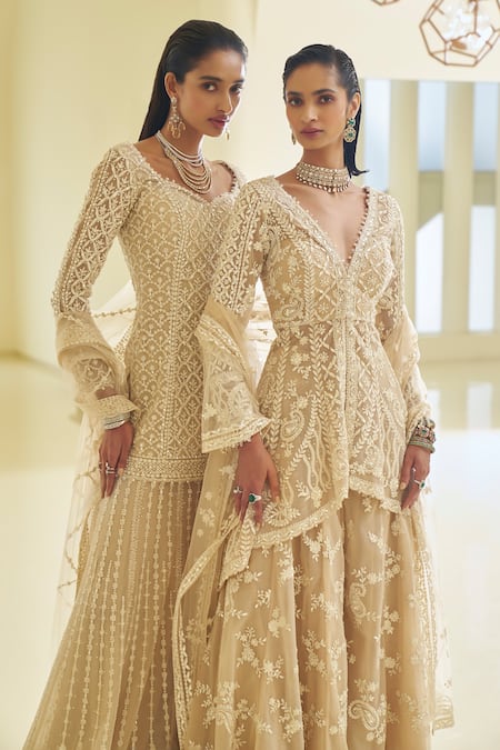 Seema Gujral_Beige Net Sequins, Pearls, Paisley Embroidered High-low Jacket Sharara Set _at_Aza_Fashions