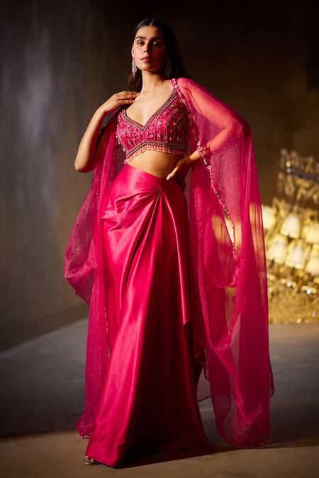 Divya Aggarwal Fuchsia Heavy Satin Embellished Beads Leaf Neck Rose Border Cape Skirt Set at Aza Fashions Divya Aggarwal_Fuchsia Heavy Satin Embellished Beads Leaf Neck Rose Border Cape Skirt Set _at_Aza_Fashions