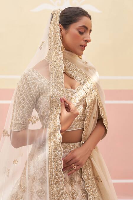 Buy Angad Singh Ivory Silk, Crepe, Chiffon Zari, Sequins, Embroidered Bridal Lehenga Set Online at Aza Fashions Buy_Angad Singh_Ivory Silk, Crepe, Chiffon Zari, Sequins, Embroidered Bridal Lehenga Set _Online_at_Aza_Fashions